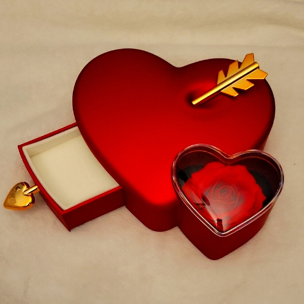 Heart-Shaped Red Jewelry Box with Gold Arrow.